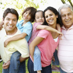 A multi-generational latin family having fun outdoors