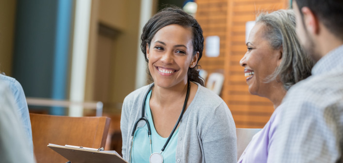 Healthcare professional talks with patients