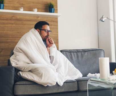 Young man suffering from cold and coughing