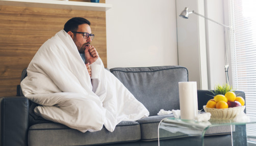 Young man suffering from cold and coughing