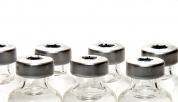 many vials with needle vaccine