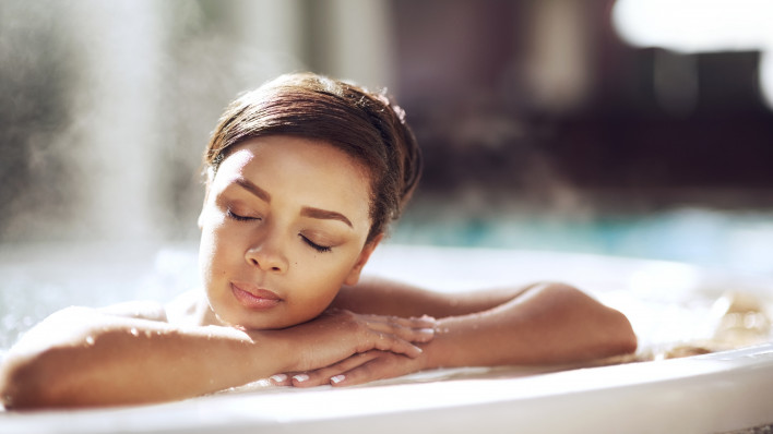 woman soaking in hot tub