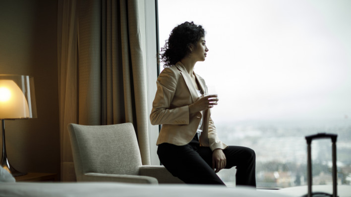 Businesswoman relaxing in a hotel room