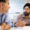 Michael Emerman, PhD (left), and Harmit Malik, PhD, discuss their collaboration.