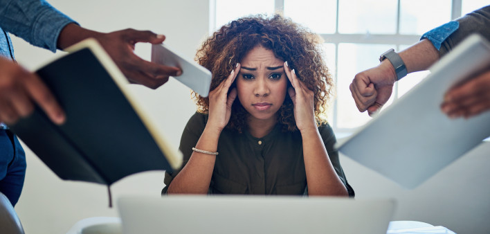 Shot of a stressed out young woman working in a demanding career