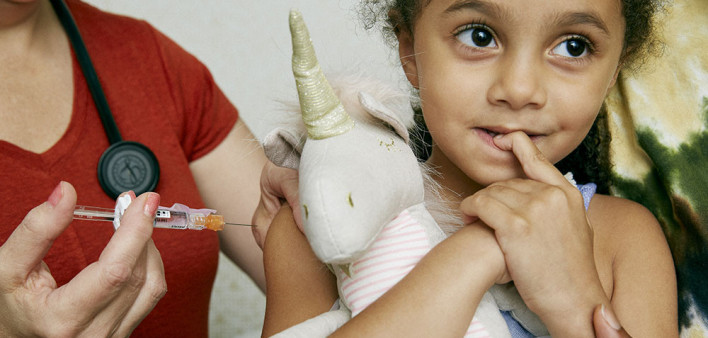 girl receiving a vaccine