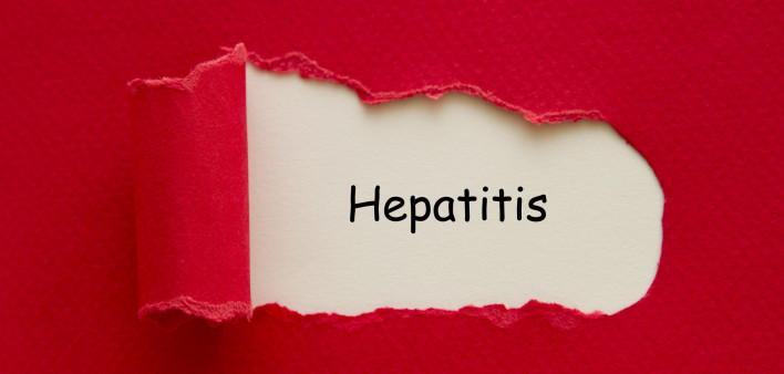 Hepatitis word written under torn paper