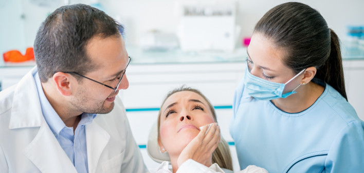 Woman with a tooth pain at the dentist