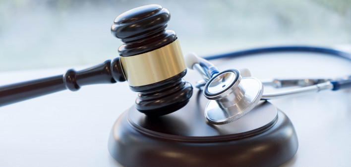 Gavel and stethoscope. medical jurisprudence. legal definition of medical malpractice. attorney. common errors doctors, nurses and hospitals make