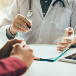 Doctor talking to the patient about menopause and treatment in future.