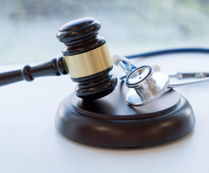 Gavel and stethoscope. medical jurisprudence. legal definition of medical malpractice. attorney. common errors doctors, nurses and hospitals make