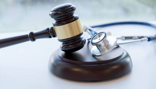 Gavel and stethoscope. medical jurisprudence. legal definition of medical malpractice. attorney. common errors doctors, nurses and hospitals make