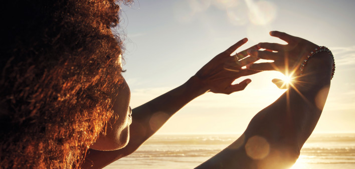 woman sun rise hands out happy