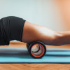 womans legs on roller gym mat