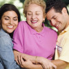 Hispanic mother with adult children hugging