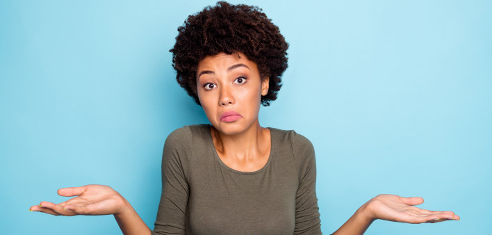 I dont care. Portrait of doubtful negative curly hair afro american girl cant choose answer solve trouble shrug shoulders hold hands hesitate wear beautiful outfit