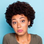 I dont care. Portrait of doubtful negative curly hair afro american girl cant choose answer solve trouble shrug shoulders hold hands hesitate wear beautiful outfit