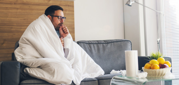 Young man suffering from cold and coughing