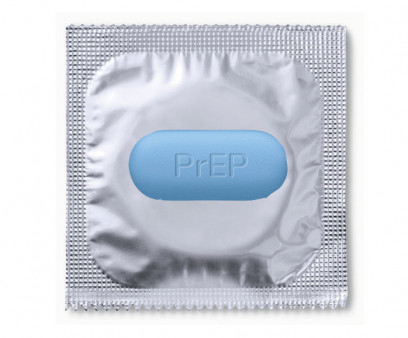 PrEP Pill and condom in silver wrapper