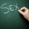 "SEX" being written on a blackboard