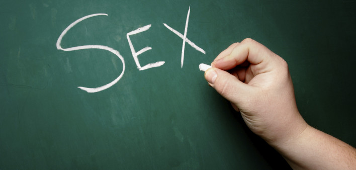 "SEX" being written on a blackboard