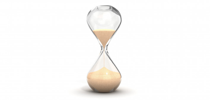 an hourglass with sand running downwards