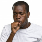 African-American man coughing