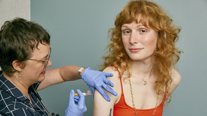 girl receiving a vaccine