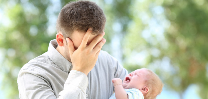 Worried father and baby crying