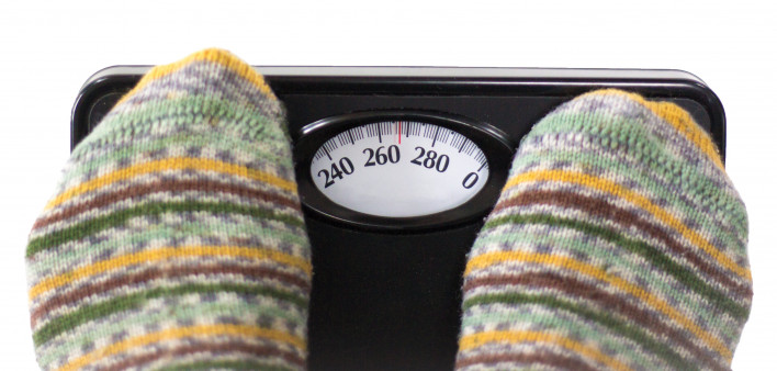 socked feet on scale