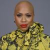 Representative Ayanna Pressley reveals her bald head.