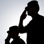 Soldiers Salute the Flag at Sunset