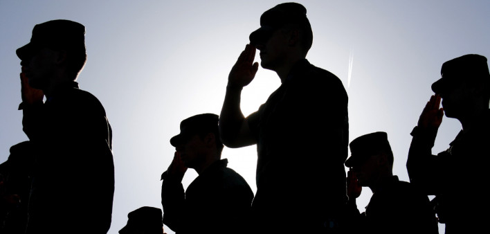 Soldiers Salute the Flag at Sunset