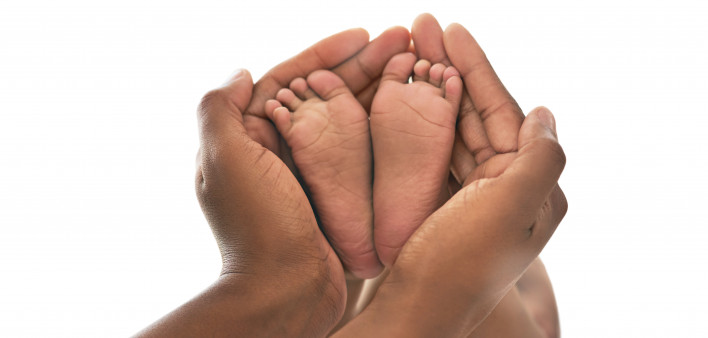 Hands and baby feet