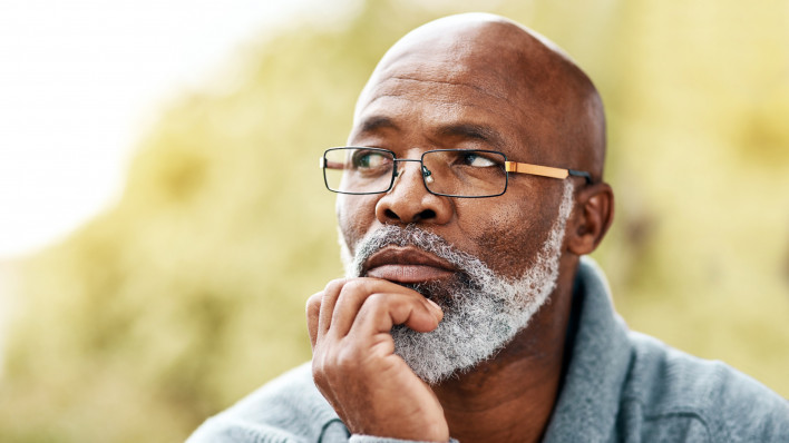 senior man outdoors thinking