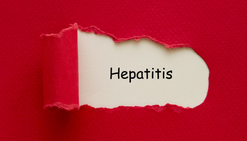 Hepatitis word written under torn paper