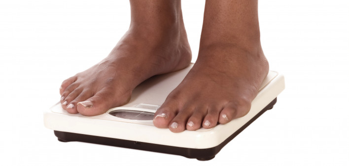 standing on scale weight