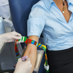 woman giving blood at blood bank
