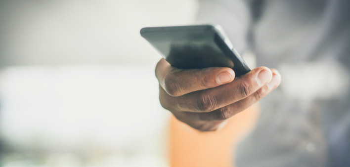 hand holding smart phone