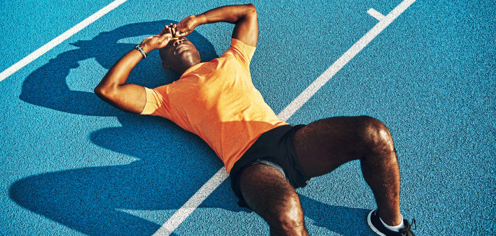 runner laying on track