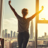 happy woman stretches and opens the curtains at window in morning