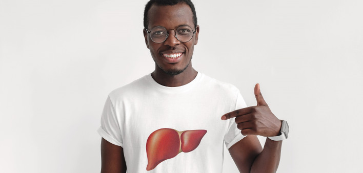 young black man wearing and pointing at t shirt with picture of liver