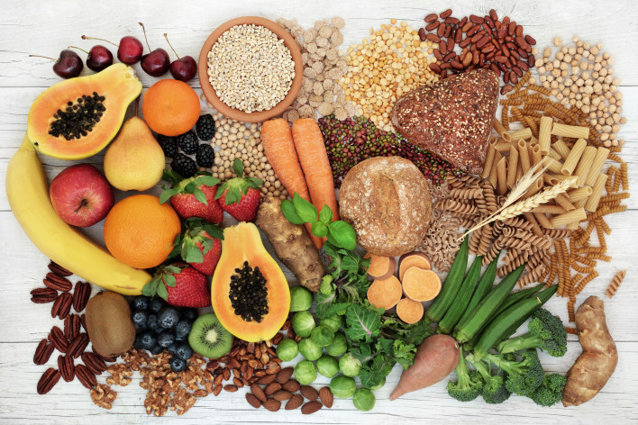 food with high fiber content for a healthy diet with fruit, vegetables, whole wheat bread, pasta, nuts, legumes, grains and cereals