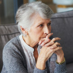Shot of a senior woman suffering from stress at home