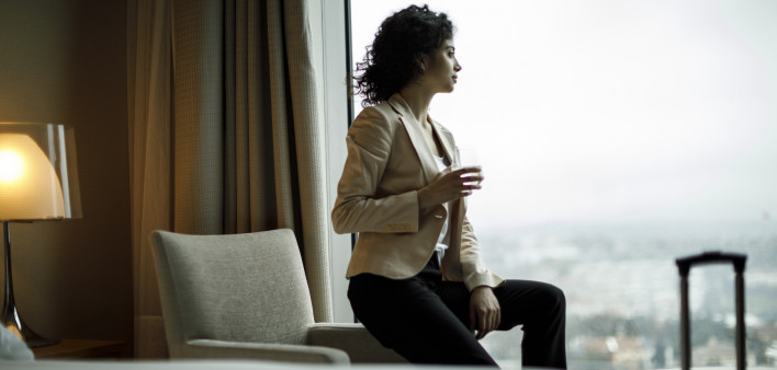 Businesswoman relaxing in a hotel room