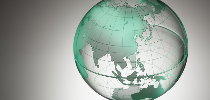 a transparent globe showing Asia