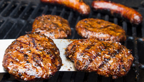 hamburgers and hotdogs on the grill