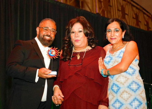 Lorena Borjas, center, received the Fuerza Award from the Latino Commission on AIDS in 2019. Next to her are George Fesser and Daniela Simba.