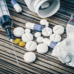syringe and pills