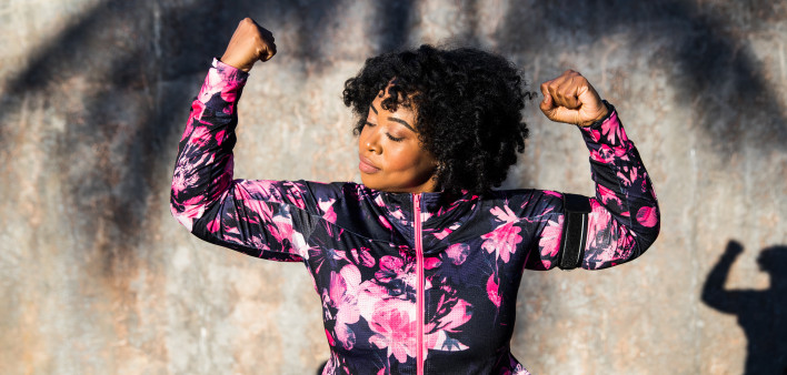 Funny portrait of a young black curvy woman during a training session